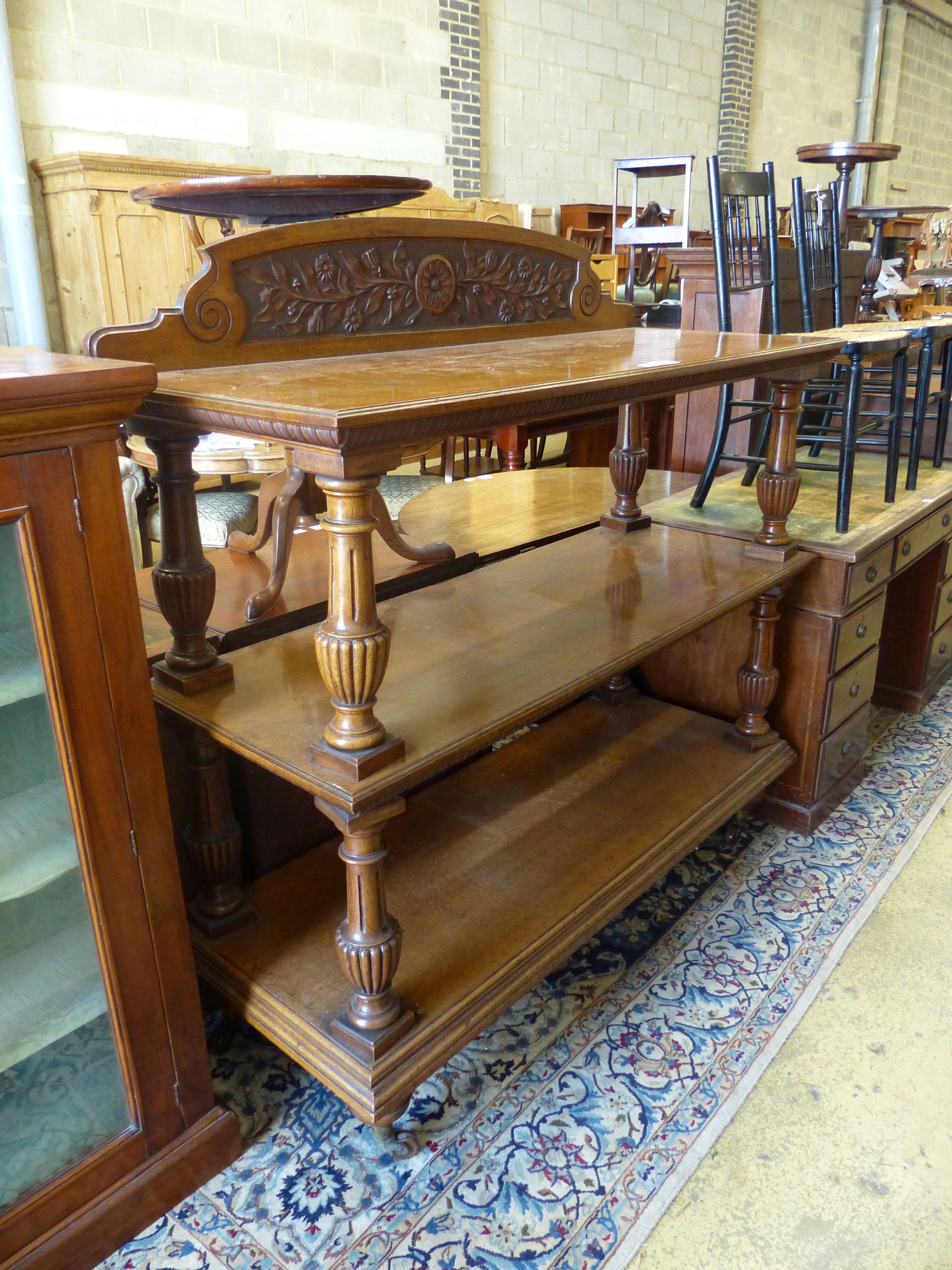 A late Victorian oak three tier buffet, length 136cm, depth 54cm, height 140cm